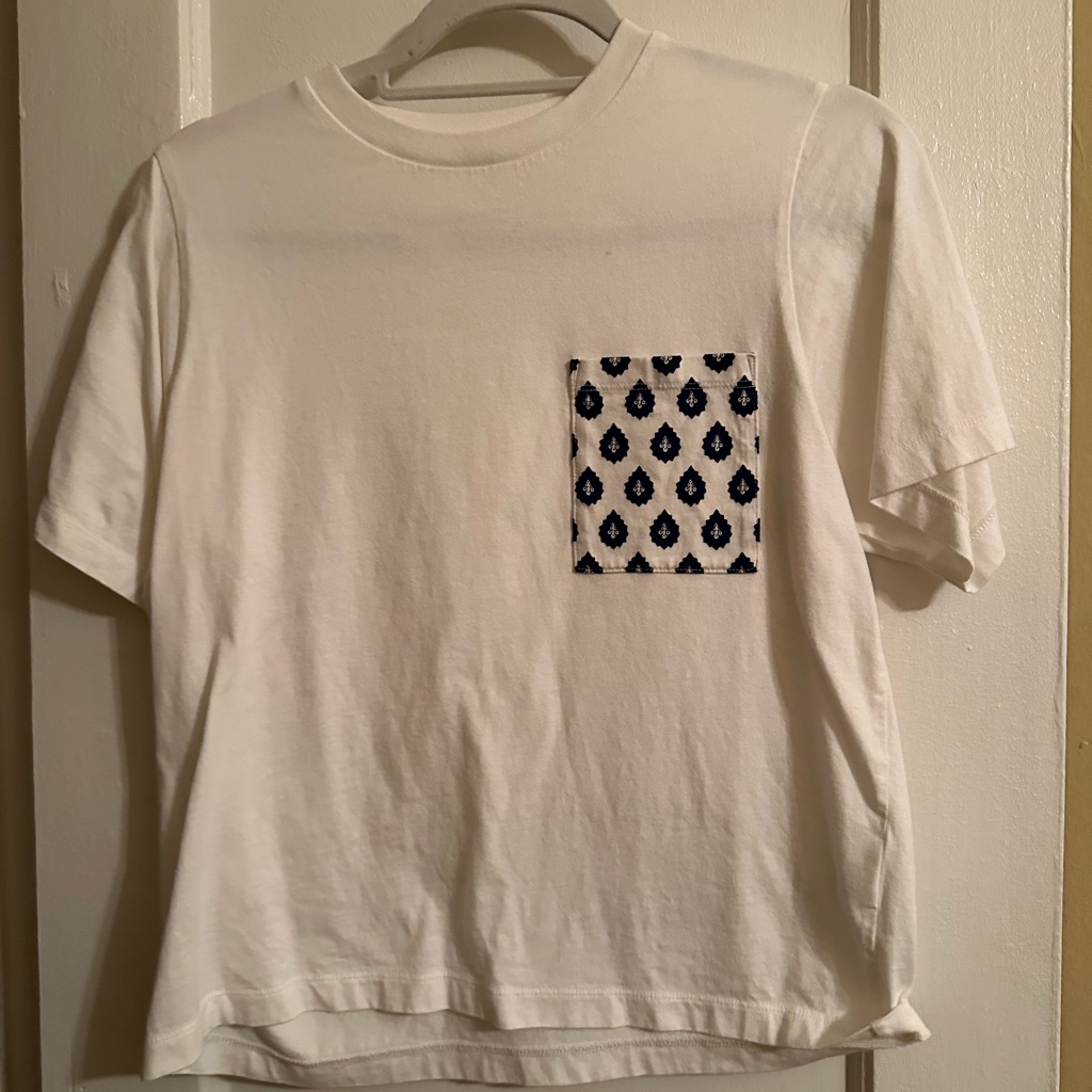 A Designed Pocket On A Basic White Tee